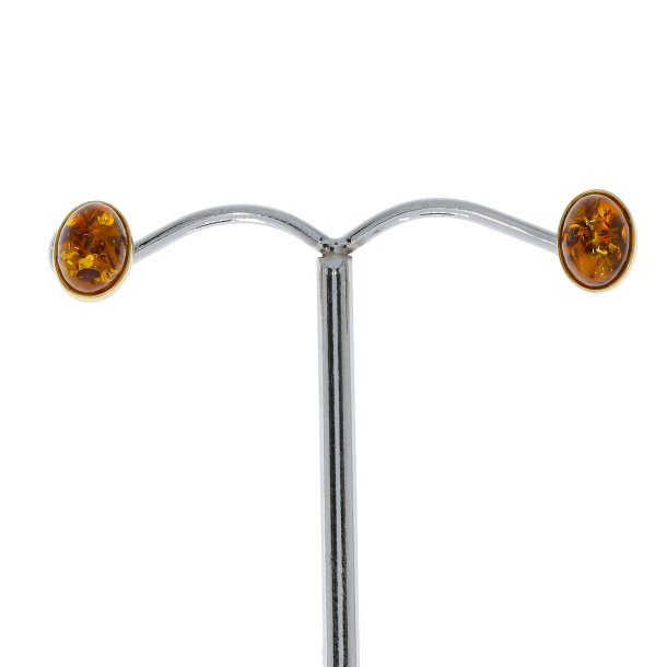 Diskrete ovale �restikker i forgyldt s�lv 