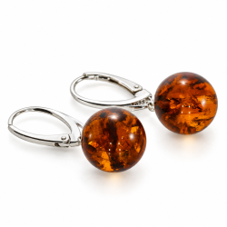 Eksklusive rav�reringe med store runde perler af �gte cognac rav og 925 sterling s�lv. Smukke naturlige strukturer g�r hvert par unikt.