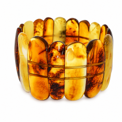 Eksklusivt h�ndlavet armb�nd med flerfarvet Vesterhavet rav i cognac-, honning- og creme nuancer. Elegant statement smykke i luksusdesign.